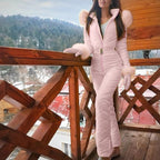 Pink quilted jumpsuit with a belt and front zip, worn with matching mittens.