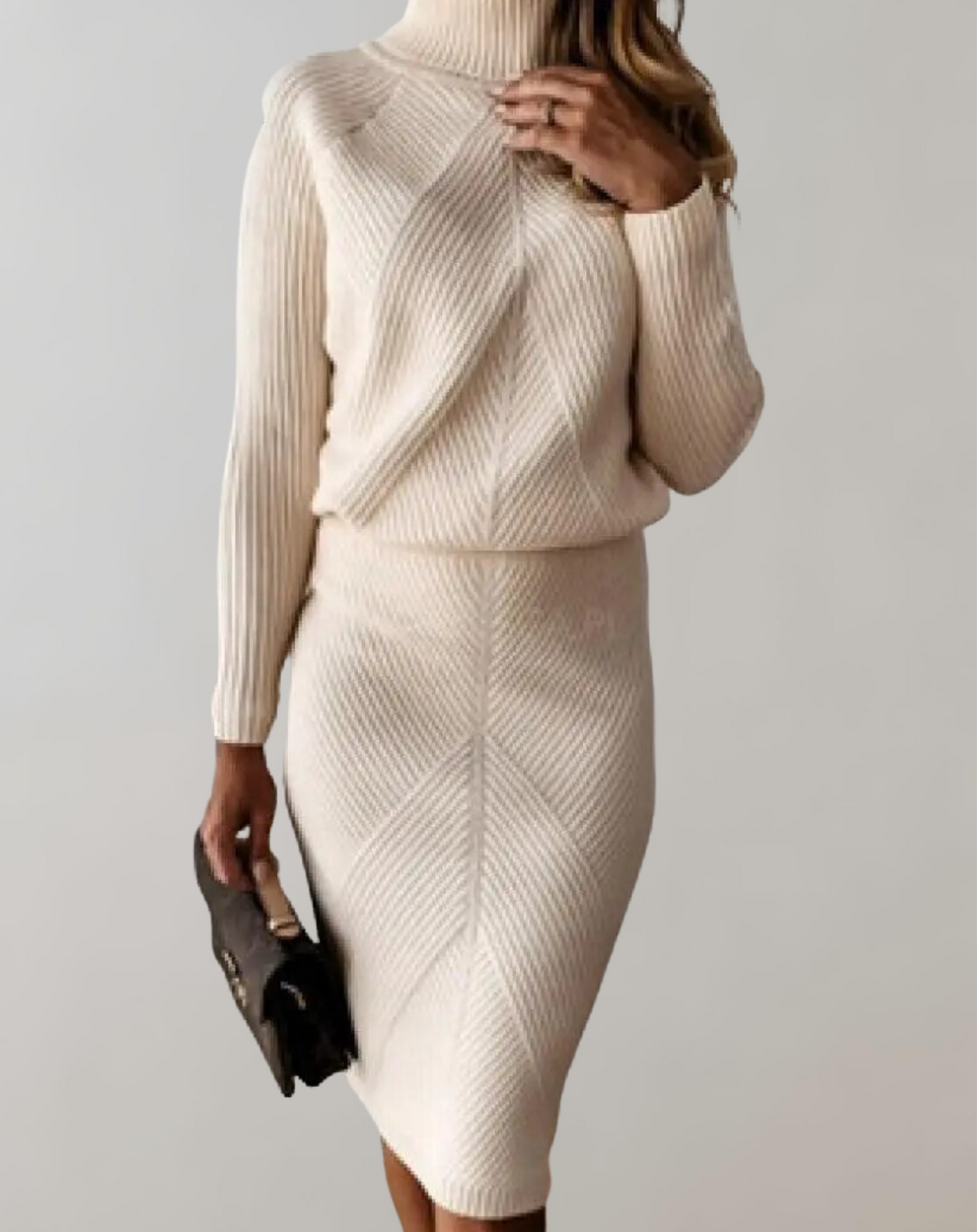 Pale peach knit set with a high-neck jumper and slim skirt.