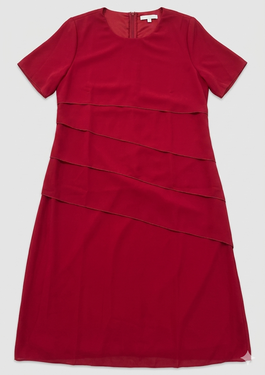 Red layered dress laid flat, showing short sleeves and an upper-back zip at the neckline.
