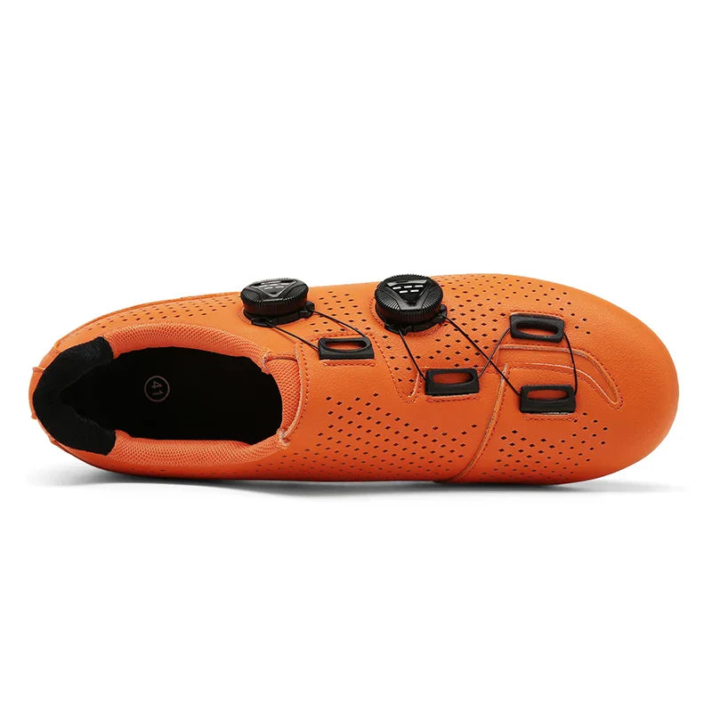 Top view of an orange cycling shoe with cable guides.