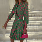 Green and pink printed blazer dress with a notched collar.