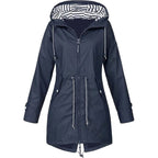 Navy blue coat with contrasting hood lining, front zip and waist drawstrings.