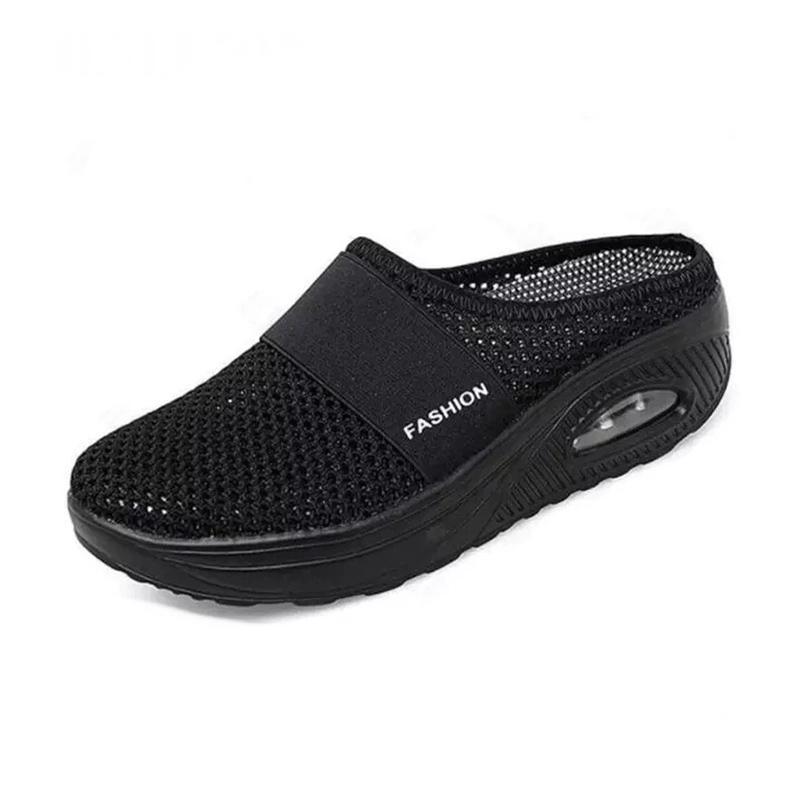 Black mesh mule with a matching dark sole.