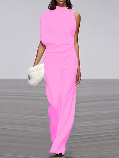 Pink sleeveless jumpsuit with a draped neckline and defined waist.