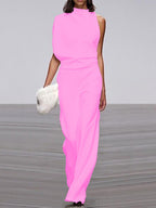 Pink sleeveless jumpsuit with a draped neckline and defined waist.