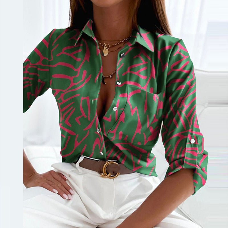 Green blouse with a pink linear print.