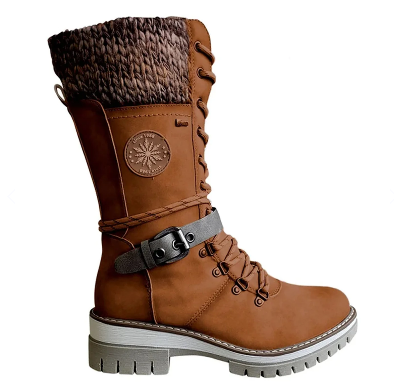 Brown tall boot with a dark ankle strap and textured cuff.