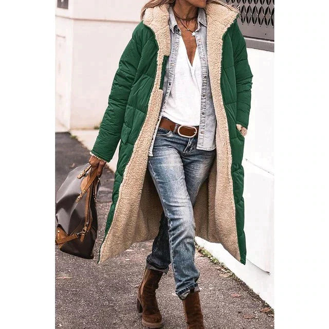 Green hooded jacket with a pale textured inner surface.