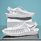 White cord sandals shown in side and three-quarter views on display blocks.