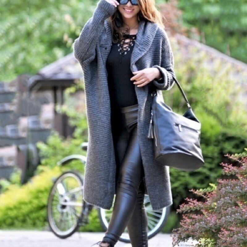 Grey long cardigan with textured knit and an open front.