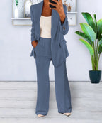 Light blue suit with a long-sleeved jacket and matching trousers.
