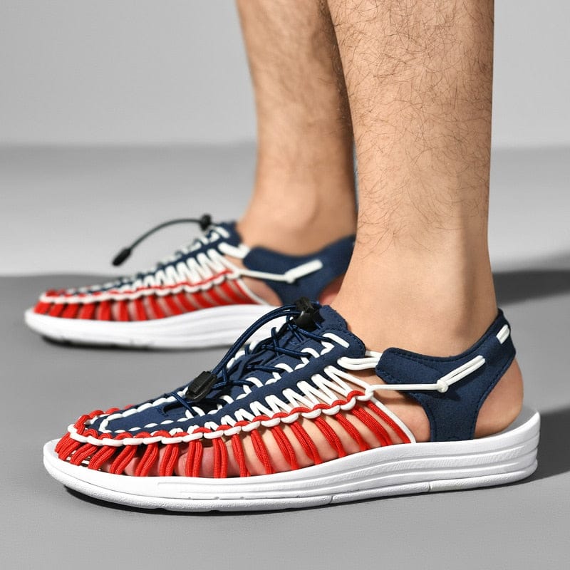 Blue, red and white cord sandals worn with open heels visible.