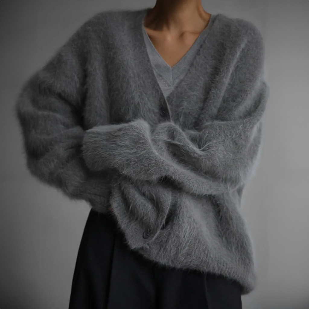 Dark grey V-neck cardigan with loose long sleeves folded across the front.