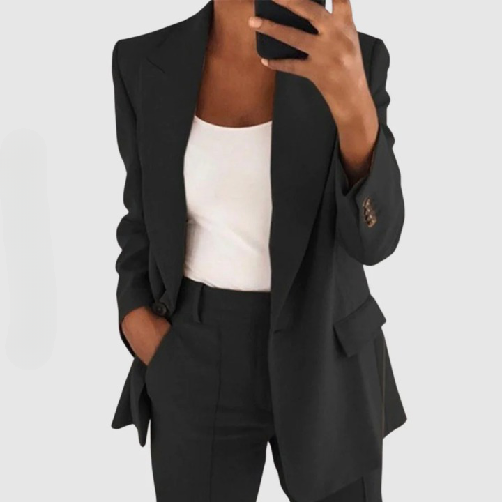 Close view of a black single-button blazer and trouser set.