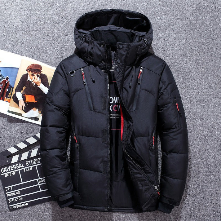 Black padded jacket with an adjustable hood and front zip.