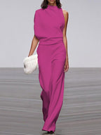 Rose-red jumpsuit with a high neckline and wide legs.