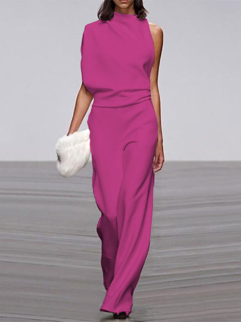 Rose-red jumpsuit with a high neckline and wide legs.