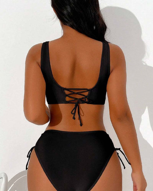 Rear view of black bikini with a lace-up top.