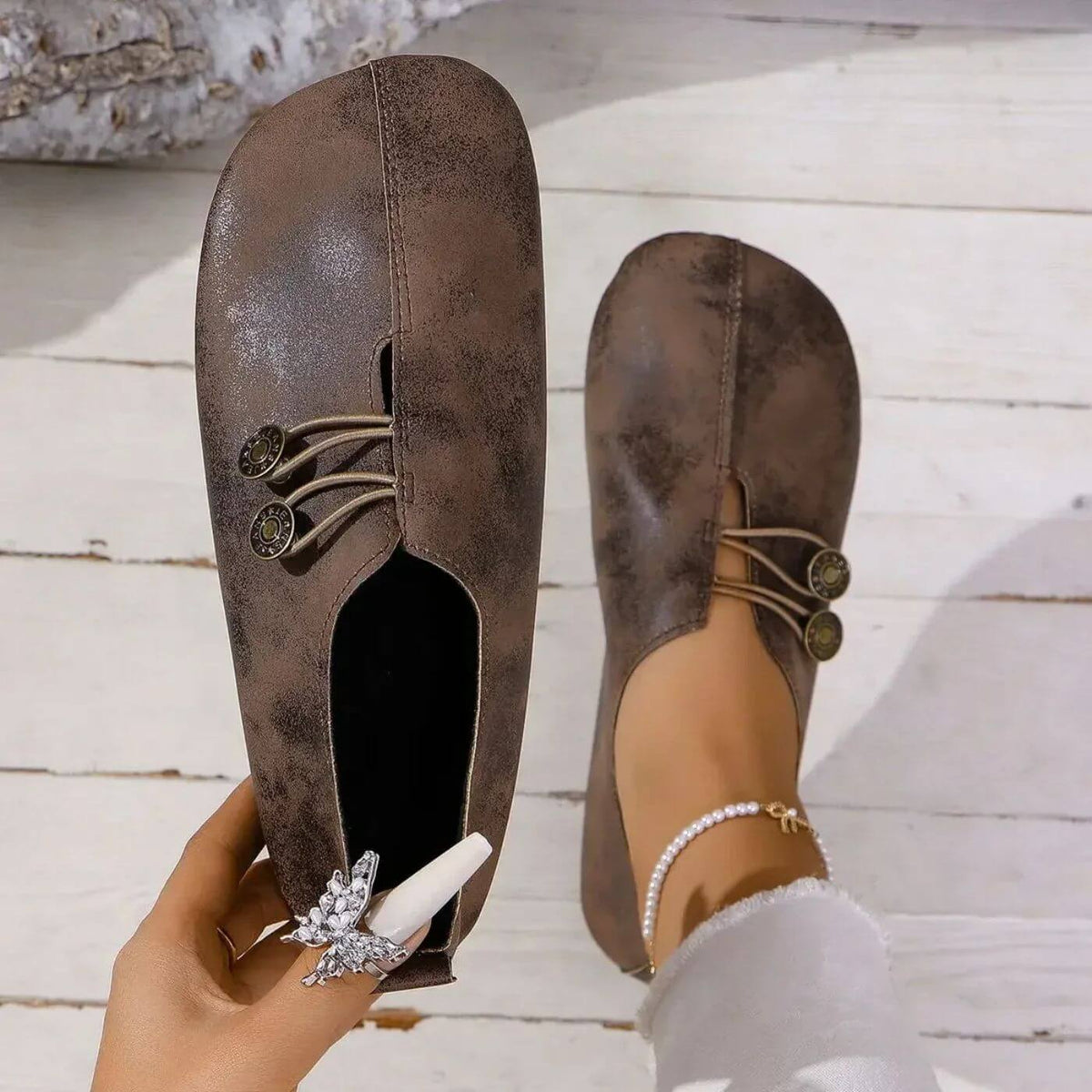 Top view of dark brown slip-on shoes with centre seams.