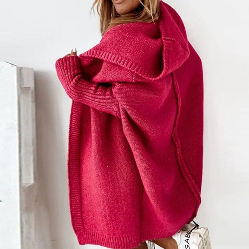 Side view of the red cardigan showing its loose shape.