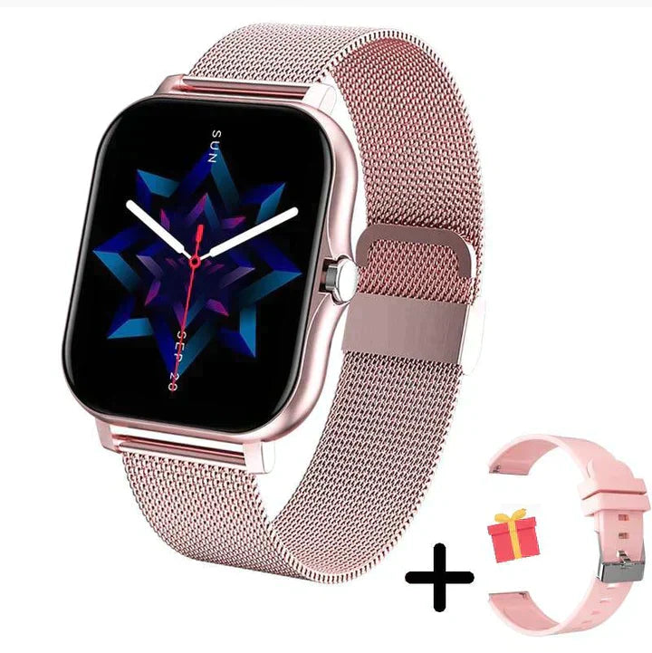 Pink smartwatch with an analogue-style display, mesh strap and additional strap pictured beside it.