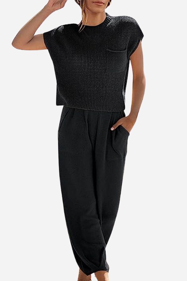 Black knit top with a chest pocket and matching roomy trousers.