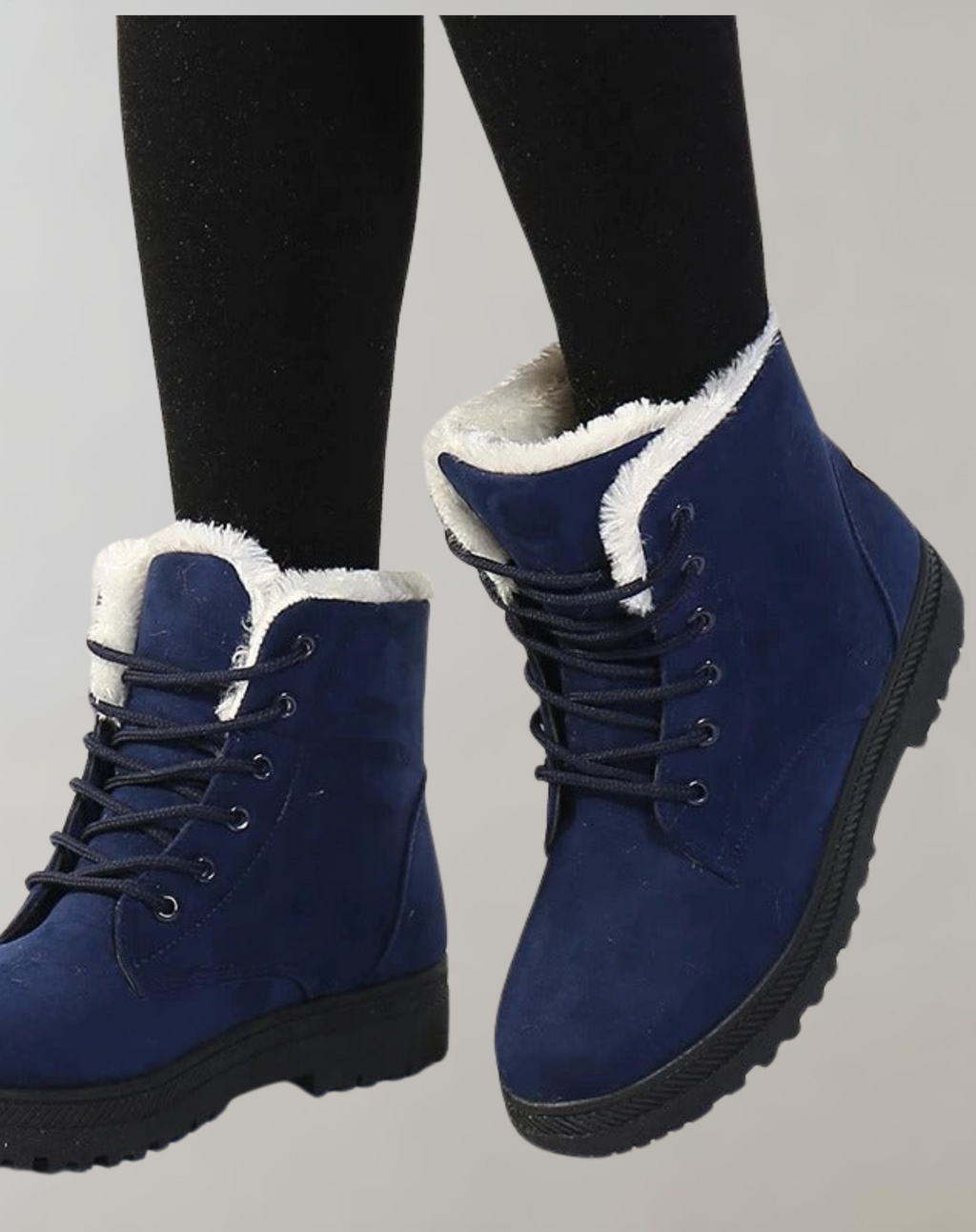 Blue lace-up ankle boots with rounded toes and a dark textured sole.
