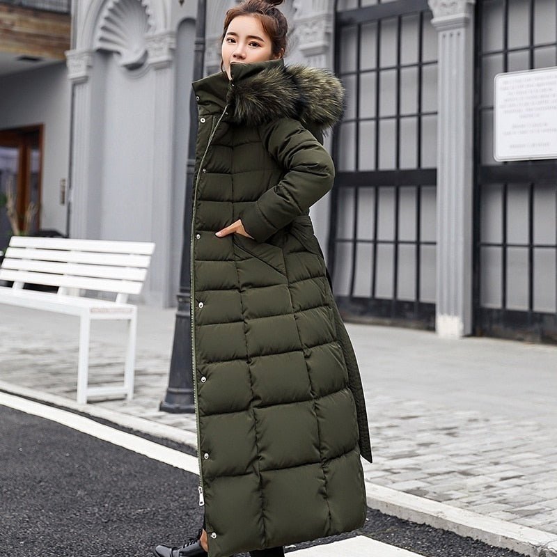 Army green quilted coat with fluffy hood trim.
