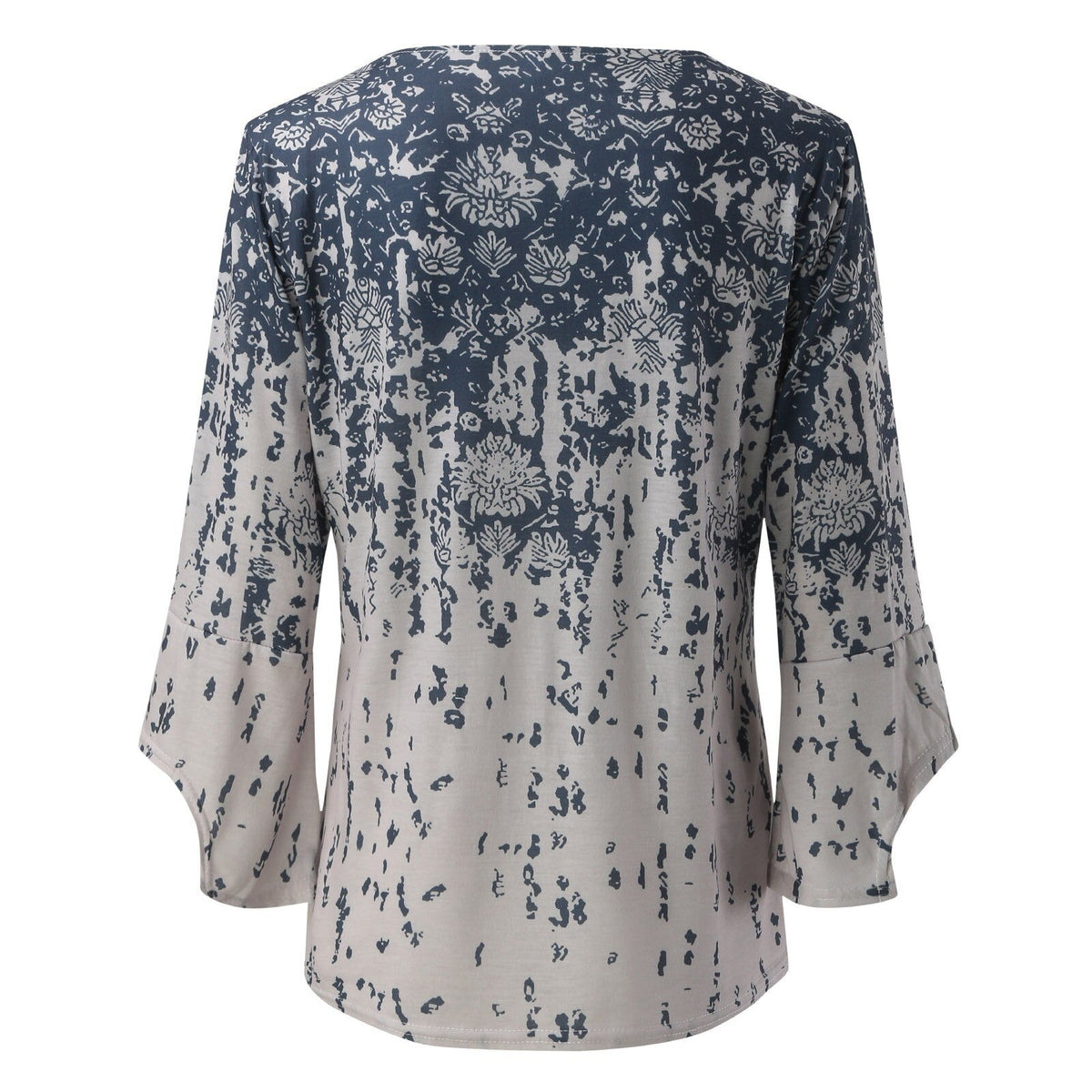 Back view of a pale blouse with a blue floral print and flared sleeves.