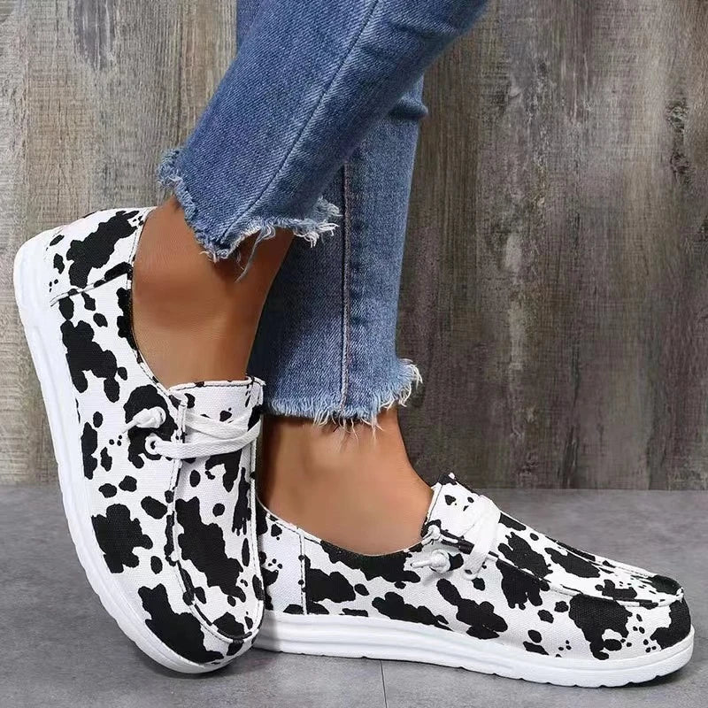 Black and white patterned lace-up shoes.