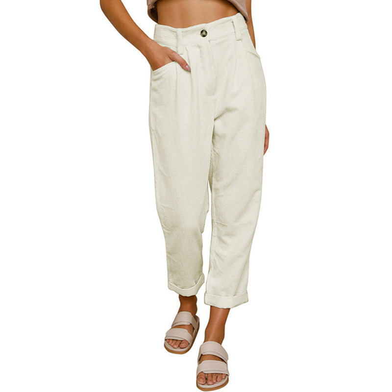 White trousers with turned-up hems and front pockets.