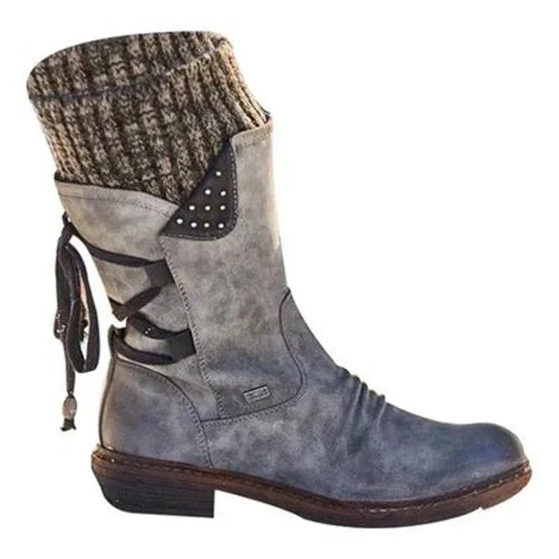 Grey boot with a brown knit cuff and dark side laces.