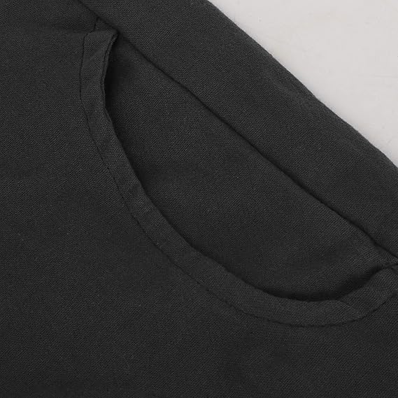 Close-up of the curved pocket opening on black trousers.