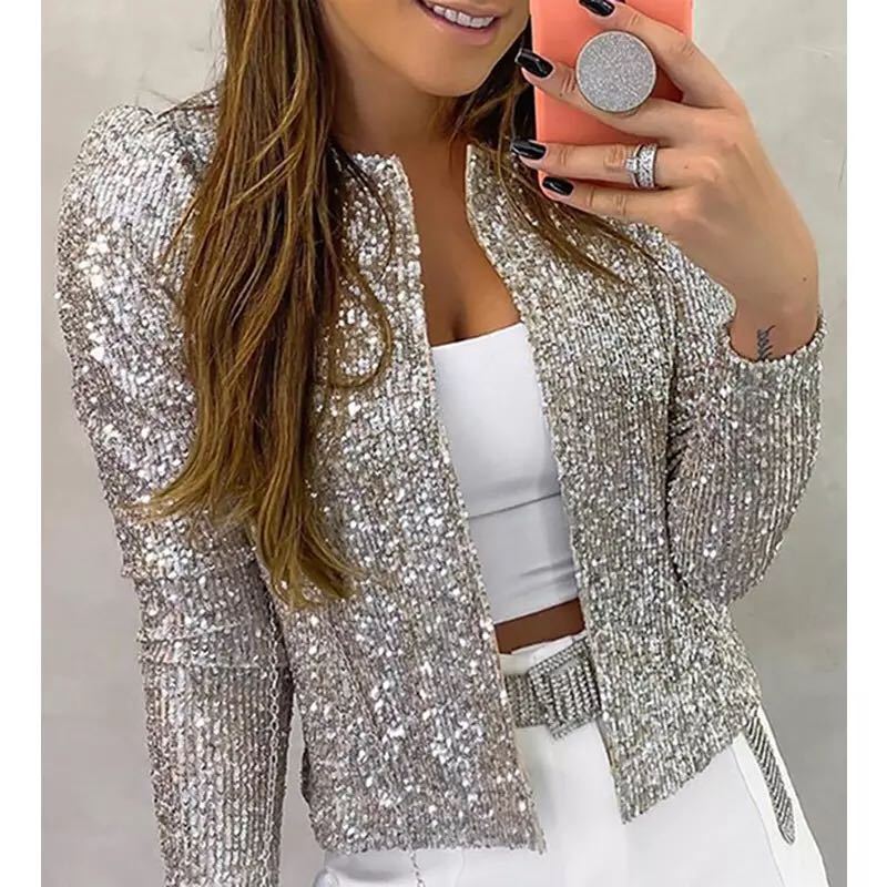 Silver sequin blazer shown with white shorts.