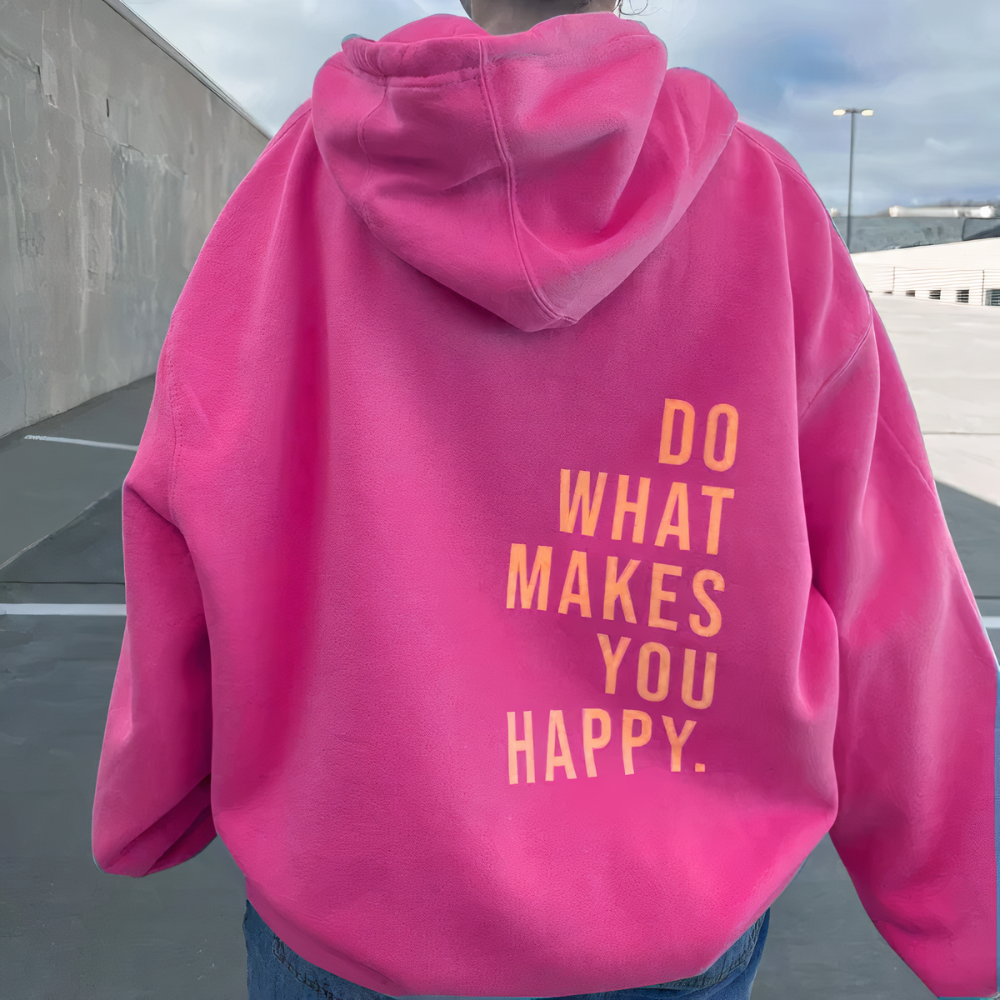 Back of a pink hoodie with yellow Do What Makes You Happy lettering.