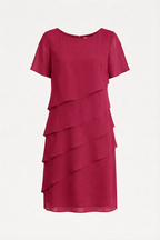 Red dress with a round neck, short sleeves and diagonal layers on a pale background.
