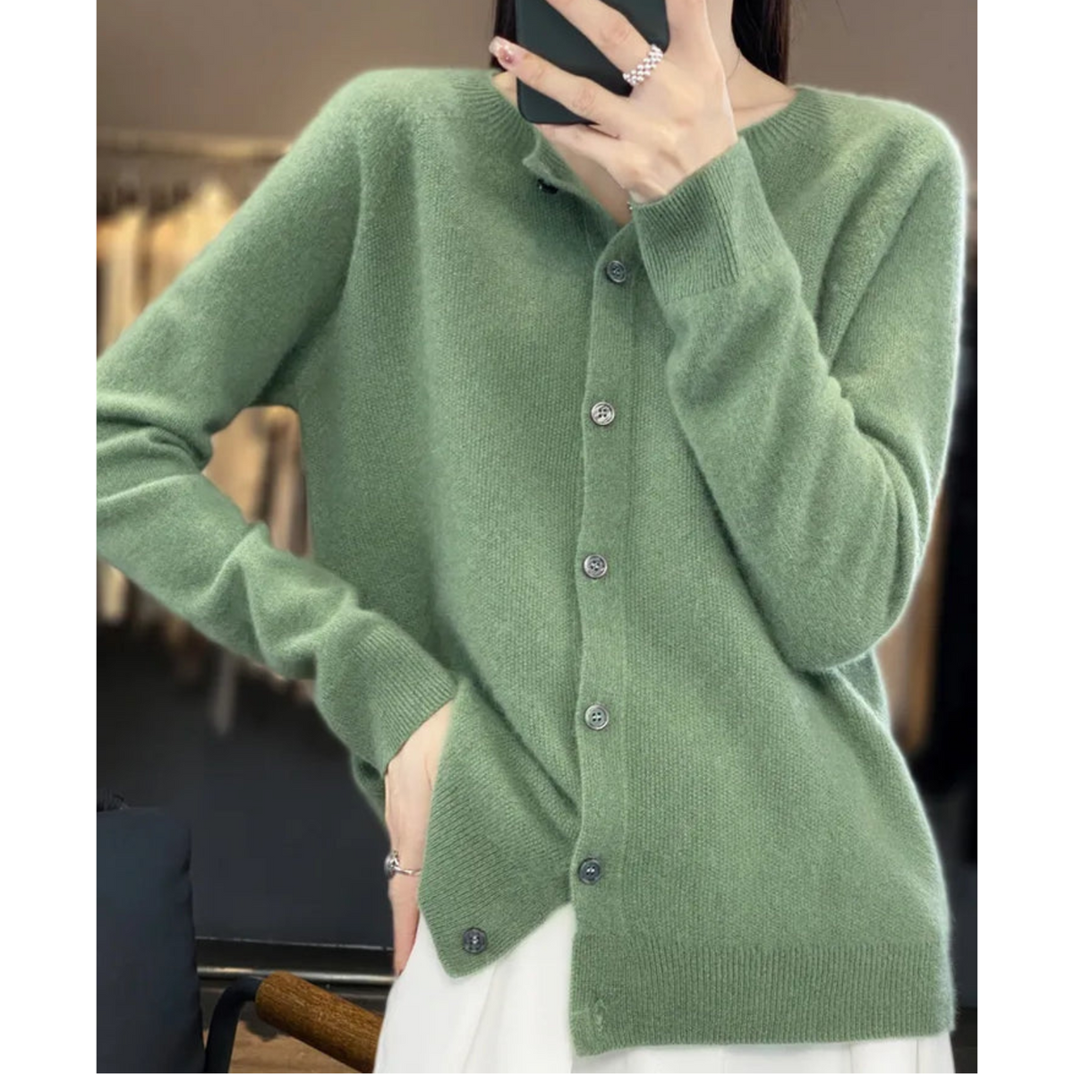 Light green button-front cardigan with a round neckline.