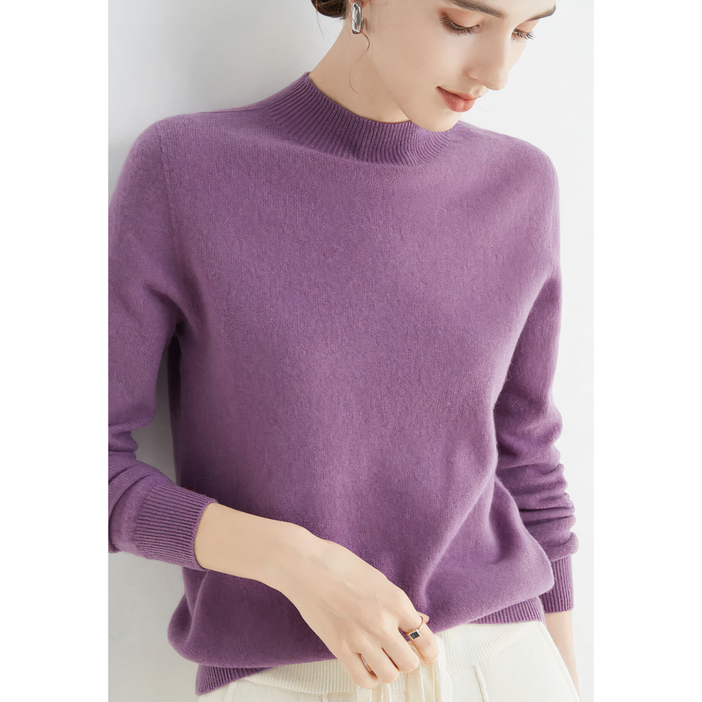 Purple jumper with a high neckline and long sleeves.