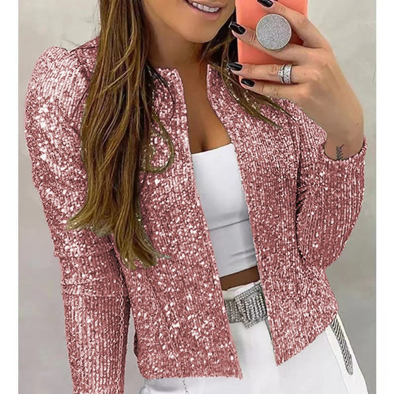 Light pink sequin blazer shown in a mirror photograph.