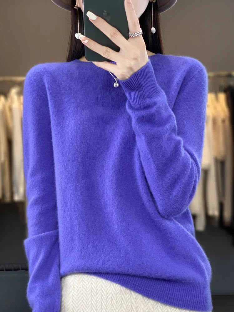 Purple jumper with a rounded neck and ribbed hem.
