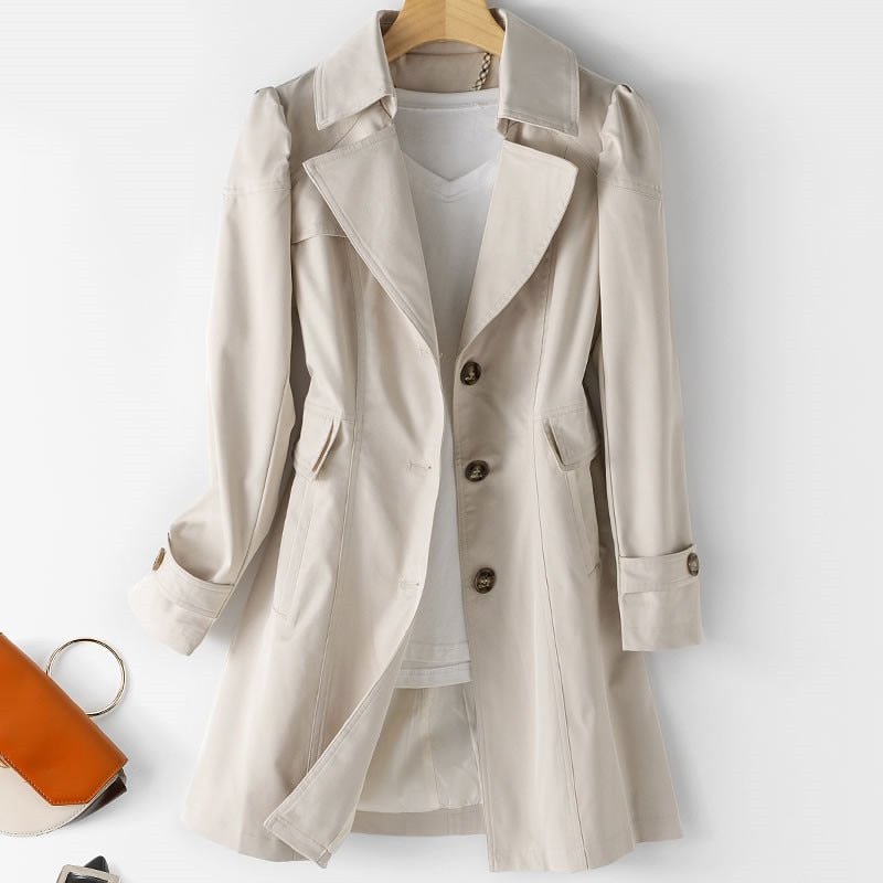 Beige trench-style jacket with three front buttons, broad lapels and tabbed cuffs on a hanger.