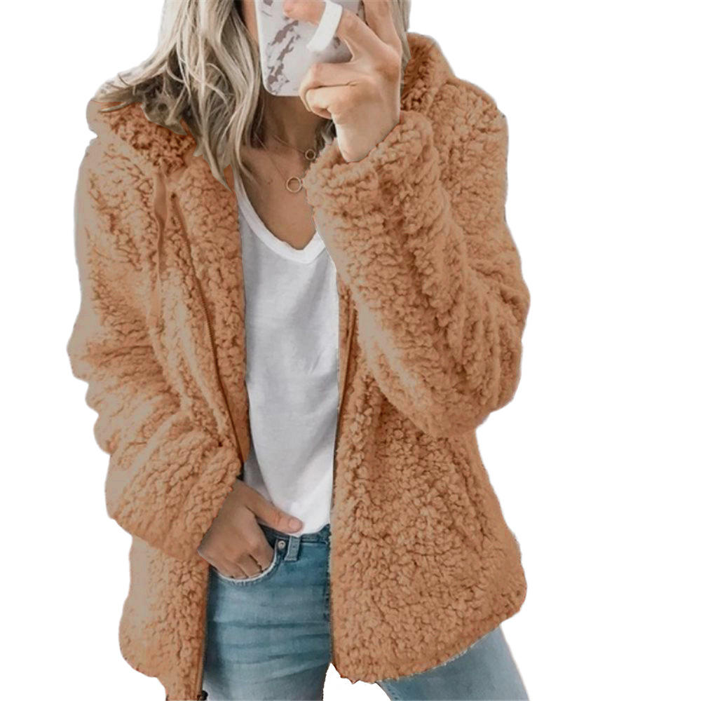 Brown teddy fleece coat worn with jeans.