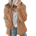 Brown teddy fleece coat worn with jeans.