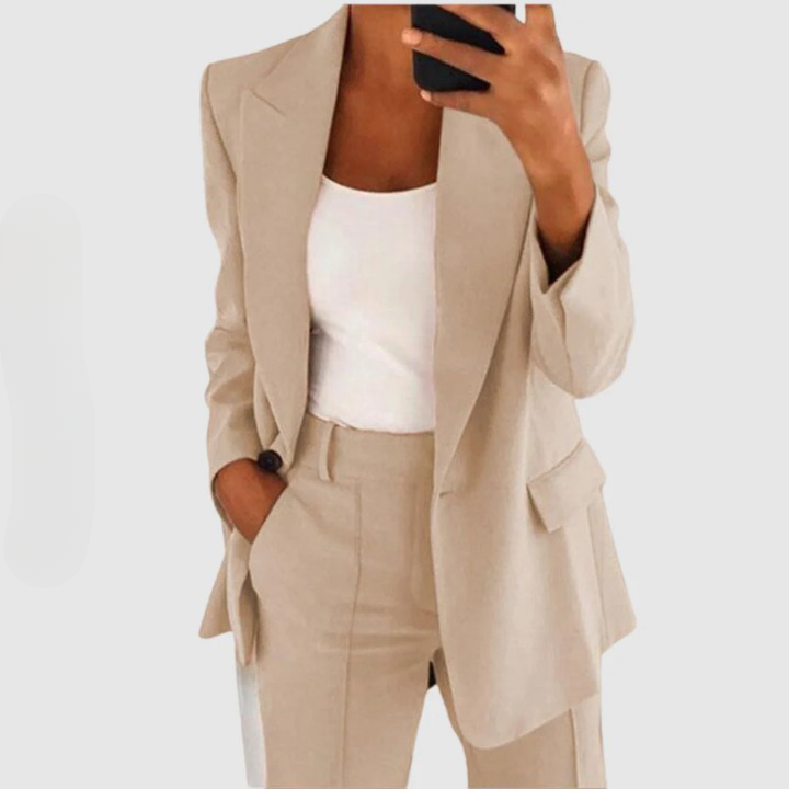 Pale beige blazer and trouser set with notched lapels.