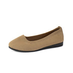 Khaki flat shoe shown from the side.