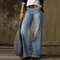 Light blue wide-leg trousers with a faded finish, worn with a belt.