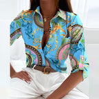 Blue blouse with a multicoloured ornamental print.