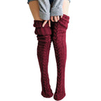 Burgundy long socks with cable-knit fronts and folded ribbed tops.