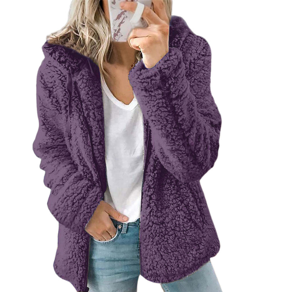 Purple teddy fleece coat worn open over a white top.