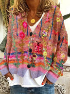 Orange-toned patterned cardigan with dark front buttons.